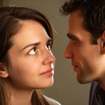 **Prompt:** A close-up shot of two individuals engaged in a deep conversation. One person speaks, while the other listens with intense focus, showing genuine empathy and understanding through their eyes and subtle facial expressions. There's a soft, warm glow connecting them, symbolizing a mental bridge being built and emotional connection. The background is slightly blurred, suggesting a quiet, intimate setting like a living room or a cozy office nook. The overall mood is one of profound understanding and connection.